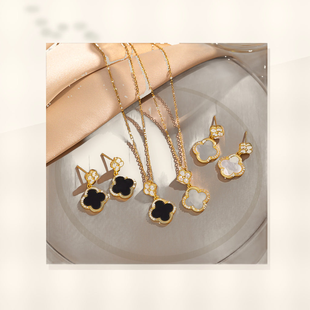 Luxury Style Clover-Shaped Titanium Steel Necklace and Earrings Set with Micro-Pavé Setting for Women and Men styled ecommerce image for women