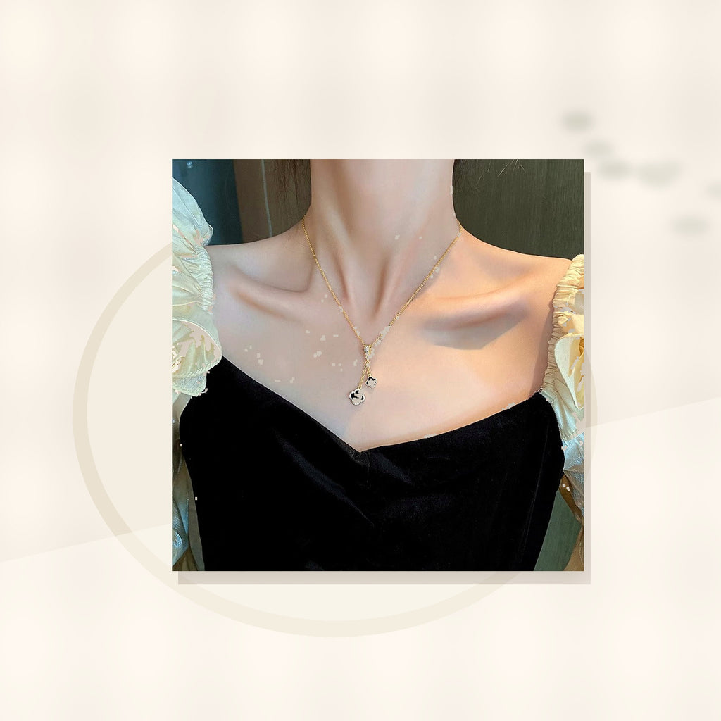 Minimalist Four-Leaf Clover Pendant Necklace for Women and Men in Titanium Steel with Micro-Pave Copper Inlay and Plated Finish on O-Chain styled ecommerce image for women