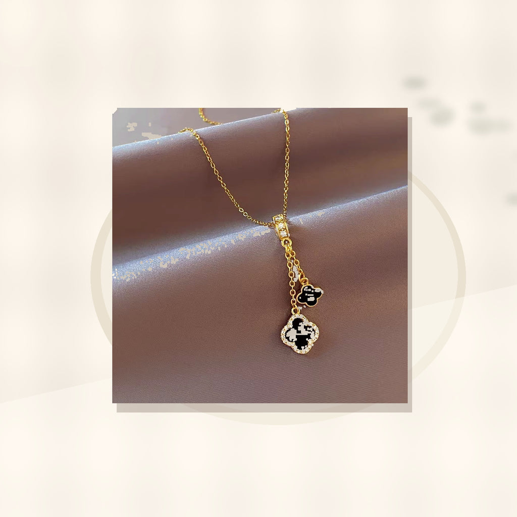 Minimalist Four-Leaf Clover Pendant Necklace for Women and Men in Titanium Steel with Micro-Pave Copper Inlay and Plated Finish on O-Chain styled ecommerce image for women
