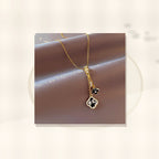 Minimalist Four-Leaf Clover Pendant Necklace for Women and Men in Titanium Steel with Micro-Pave Copper Inlay and Plated Finish on O-Chain styled ecommerce image for women
