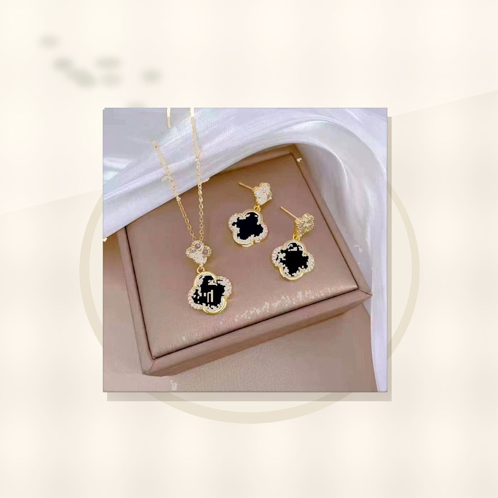 Luxury Style Clover-Shaped Titanium Steel Necklace and Earrings Set with Micro-Pavé Setting for Women and Men styled ecommerce image for women