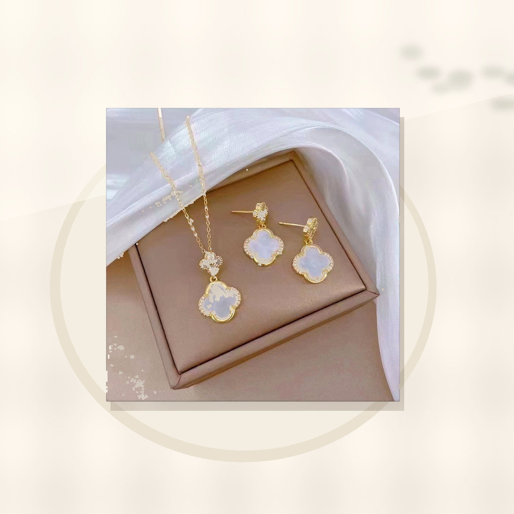 Luxury Style Clover-Shaped Titanium Steel Necklace and Earrings Set with Micro-Pavé Setting for Women and Men styled ecommerce image for women