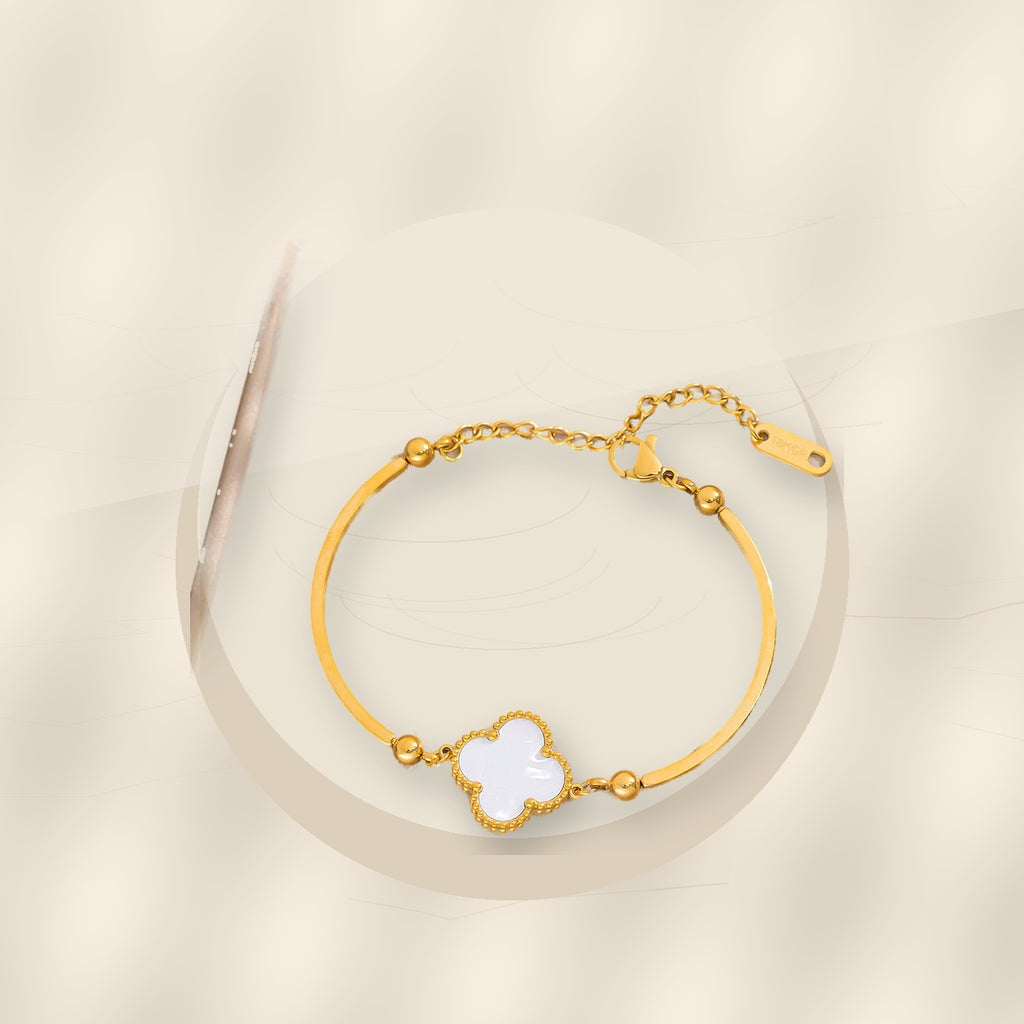 Fashionable Minimalist Four-Leaf Clover Bracelet for Women in 316L 316L Stainless Steel with Gold Electroplated Hypoallergenic Fade-Resistant Finish - ivory marble minimal luxury product photo