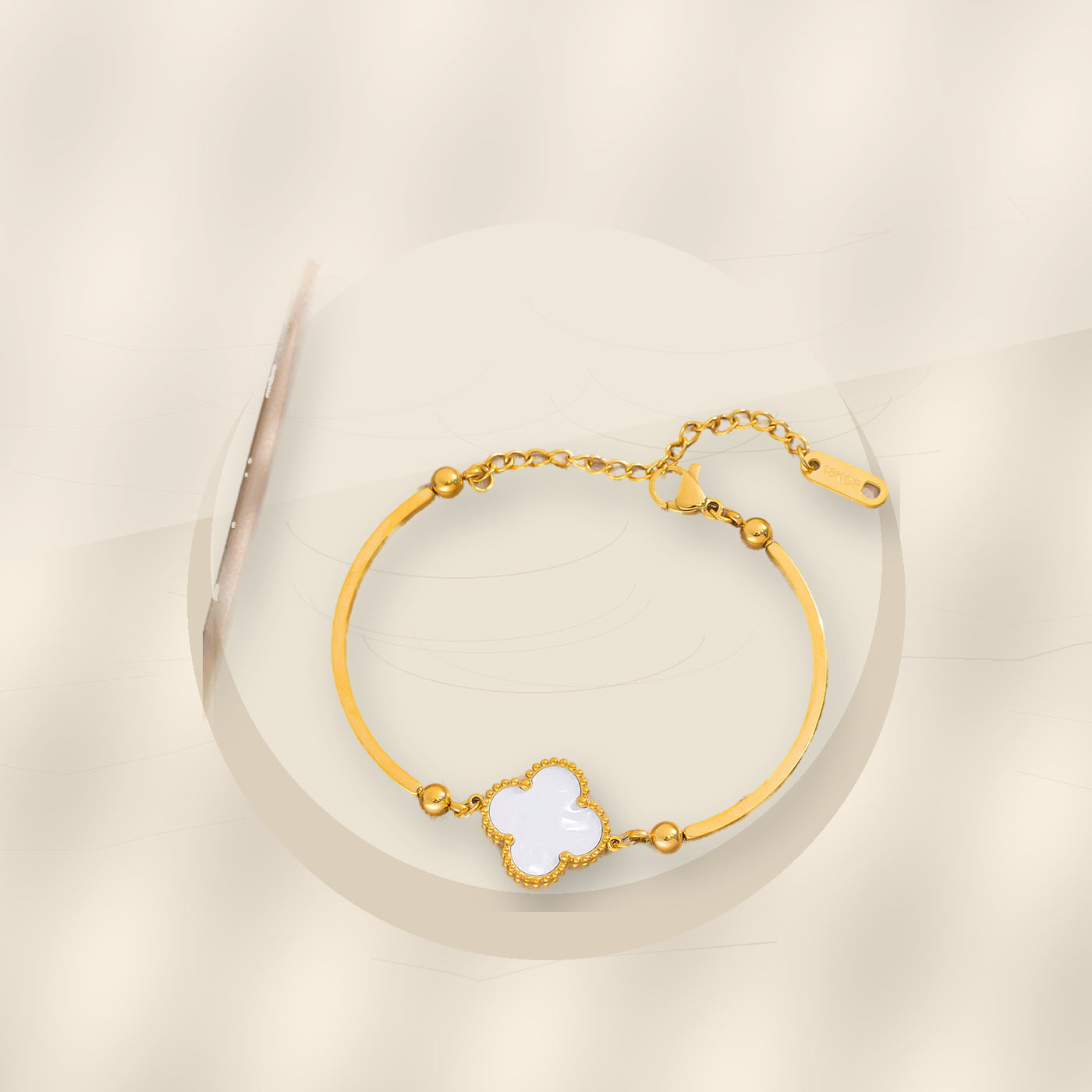 Fashionable Minimalist Four-Leaf Clover Bracelet for Women in 316L 316L Stainless Steel with Gold Electroplated Hypoallergenic Fade-Resistant Finish - ivory marble minimal luxury product photo