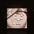 Minimalist Clover-Shaped 316L 316L Stainless Steel Necklace Set with Matching Bracelet and Earrings for Women - dark glossy luxury campaign product photo