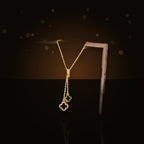 Minimalist Four-Leaf Clover Pendant Necklace for Women and Men in 316L 316L Stainless Steel with Micro-Pave 316L Stainless Steel Inlay and Plated Finish on O-Chain - dark glossy luxury campaign product photo