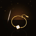 Fashionable Minimalist Four-Leaf Clover Bracelet for Women in 316L 316L Stainless Steel with Gold Electroplated Hypoallergenic Fade-Resistant Finish - dark glossy luxury campaign product photo