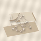Minimalist Five-Petal Flower Necklace Set in 316L 316L Stainless Steel with Laser-Cut Clover Design, Gold Electroplated finish, O-Chain, for Women - modern geometric editorial product photo